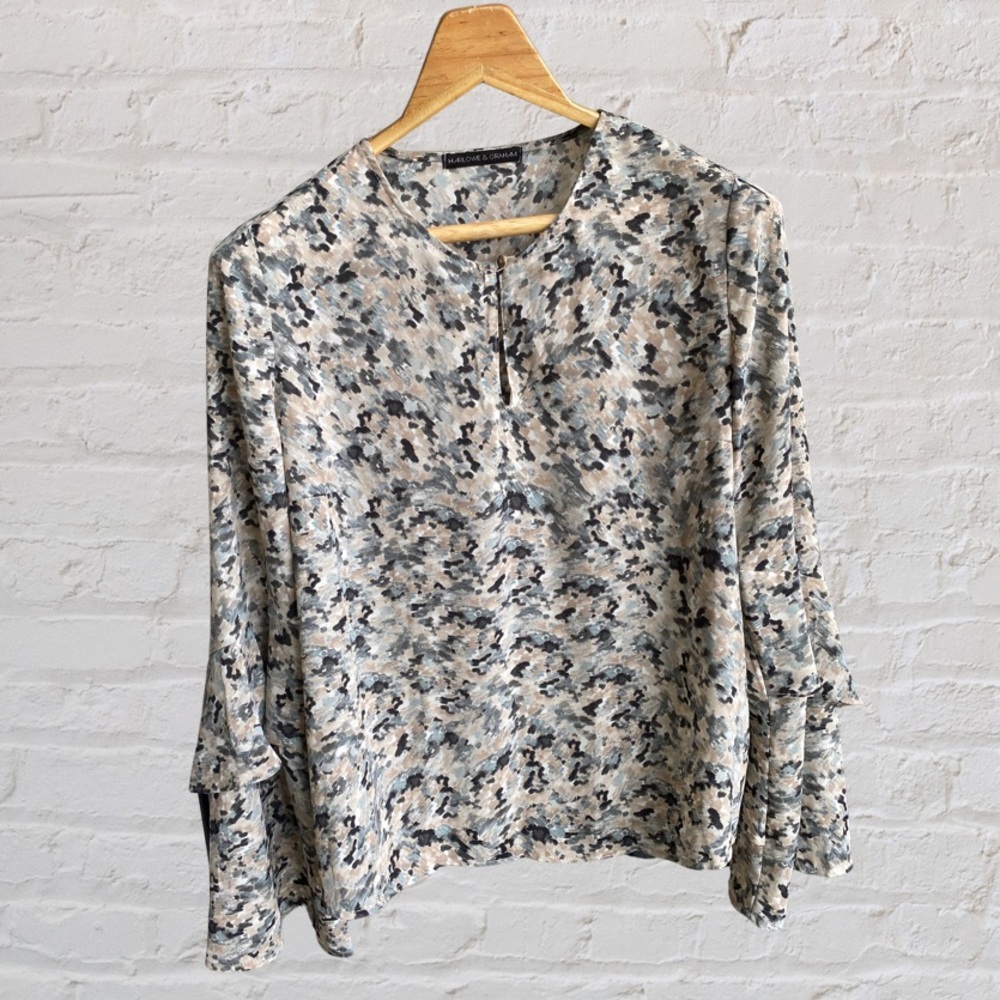 Beautiful, bell-sleeved, multi-colored blouse.